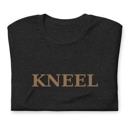 Close-up of gold KNEEL lettering on a black T-shirt
