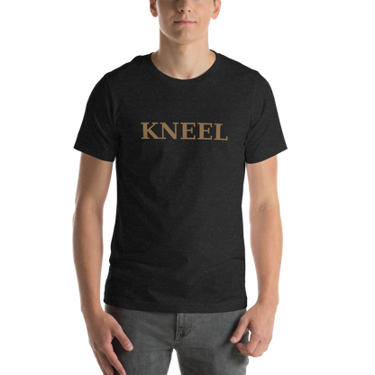Model wearing a black KNEEL T-shirt with gold lettering