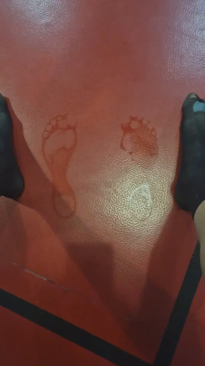 Video preview of damp footprints on an orange gym floor